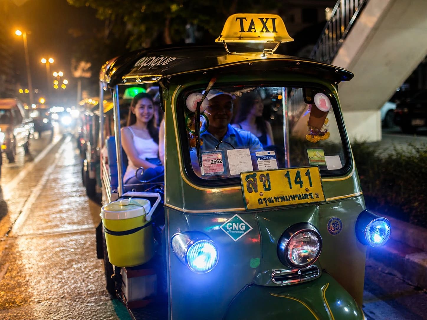 Tuk tuk on Yaowarat Road at night, Chinatown neon behind